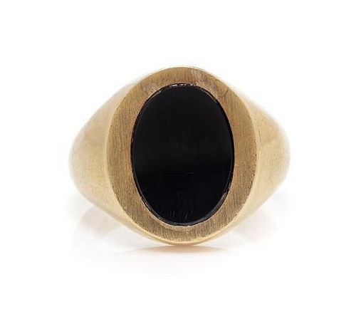 A 10 Karat Yellow Gold and Onyx Signet Ring, 7.80 dwts.