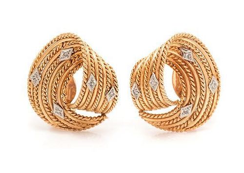 * A Collection of Yellow Gold Swirl Earclips, 26.90 dwts.