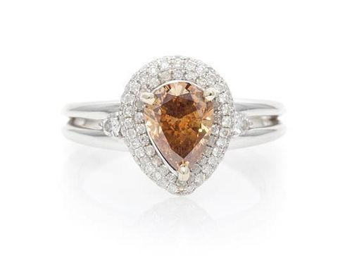 An 18 Karat White Gold, Fancy Deep Brown Diamond and Diamond Ring, 3.60 dwts.