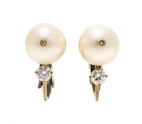 * A Pair of 14 Karat White Gold, Cultured Pearl and Diamond Earclips, 2.90 dwts.