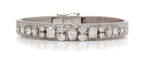 * An 18 Karat White Gold and Diamond Bangle Bracelet, 18.90 dwts.