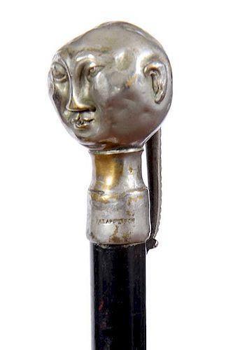 76. Chinese Portrait Cane – Ca. 1900 – A silver metal handle of a china man with a long ponytail, he has a small hole in