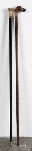Two walking sticks, ca. 1900, one with a carved dog head, the other with a chased gold-filled tip