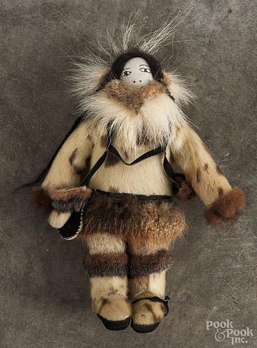 Eskimo doll, 20th c., 13'' h., together with a double-saddle blanket.