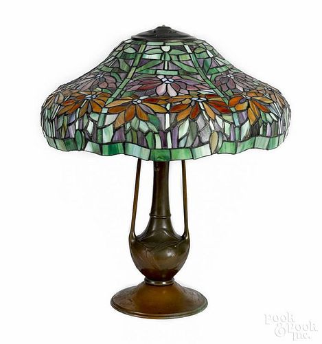 Stained glass and bronze table lamp, early 20th c., 21 1/2'' h., 18'' dia.