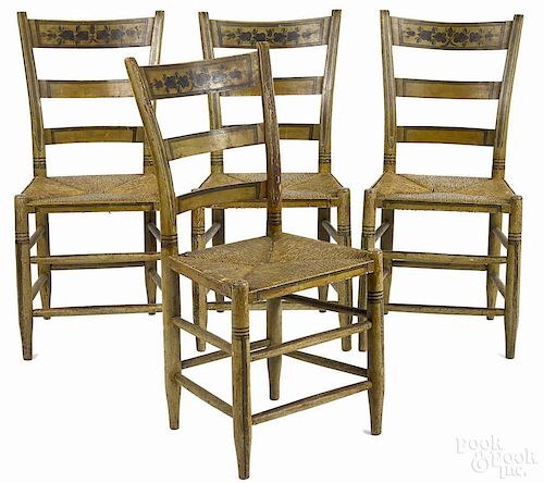 Set of four painted rush seat chairs, 19th c., retaining their original surface, with floral crests
