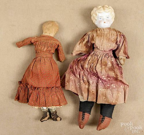 Molded head and shoulder doll, 19th c., 16'' h., together with an Amish cloth doll, 13 1/2'' h.