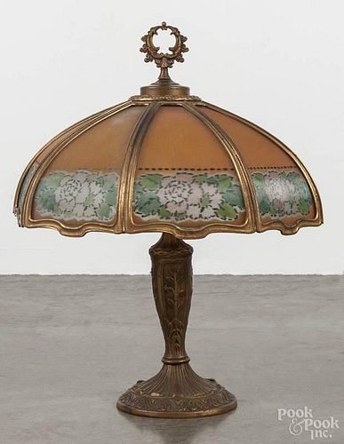 Reverse painted glass and spelter table lamp, early 20th c., with a floral ribbed shade, 24'' h.