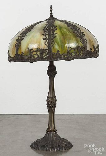 Slag glass and spelter table lamp, the shade is early 20th c., the base is contemporary, 29'' h.