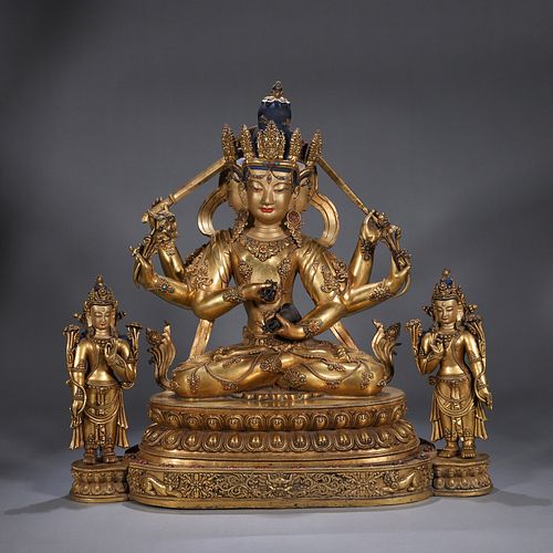 A copper three-headed six-armed buddha statue