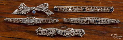 Five filigree bar pins, containing diamonds, seed pearls, and blue sapphires, platinum