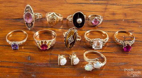Ten rings of 10K yellow gold, to include rubies, amethyst, opals, black onyx, etc., 16.9 dwt total.