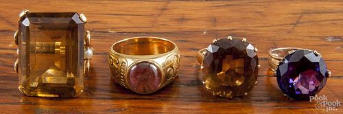 Four unmarked gold rings with large stones, such as citrine, etc., 34.1 dwt.
