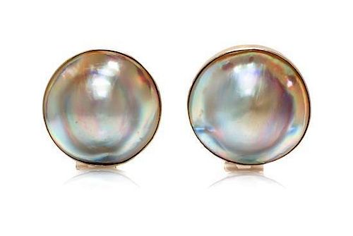 * A Pair of Sterling Silver Blister Pearl Earclips, 9.60 dwts.