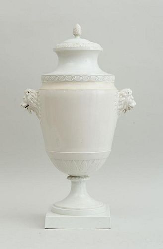 CONTINENTAL IVORY-GLAZED FAIENCE URN AND COVER