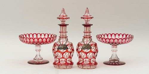 PAIR OF OVERLAY RUBY GLASS DECANTERS AND STOPPERS AND A PAIR OF OVERLAY RUBY GLASS STEMMED COMPOTES