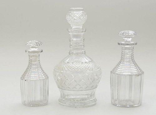 PAIR OF ANGLO-IRISH CUT CRYSTAL GRADUATED DECANTERS AND STOPPERS