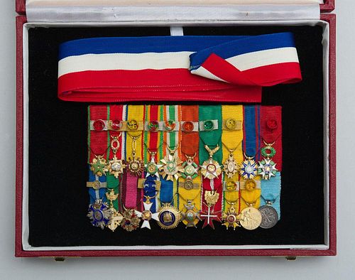 GROUP OF TWENTY DIPLOMATIC SMALL RIBBONED BADGES, MOUNTED TOGETHER AND CASED