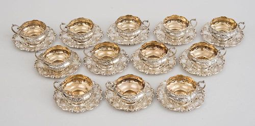SET OF TWELVE AMERICAN SILVER BOULLION CUPS AND STANDS