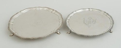 GEORGE III CRESTED SILVER TRIPOD SALVER AND A GEORGE III ARMORIAL SILVER TRIPOD SALVER