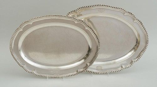 PAIR OF GEORGE III ARMORIAL SILVER GRADUATED MEAT DISHES