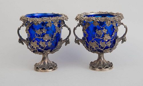 PAIR OF CONTINENTAL SILVERED METAL URNS