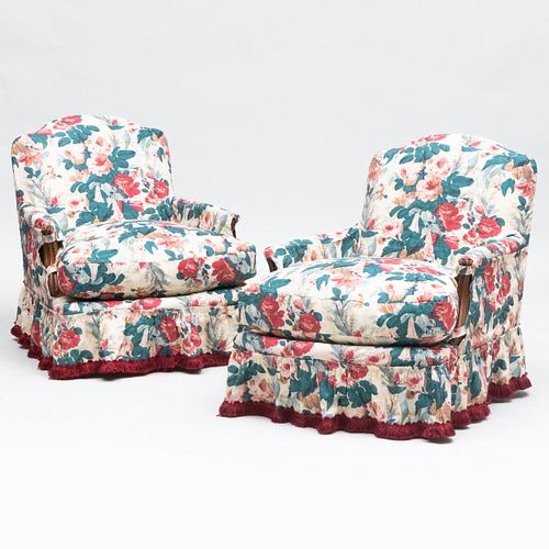 Pair of Louis XV Style Chintz Slipcovered Swivel Armchairs with a Fringed Skirt