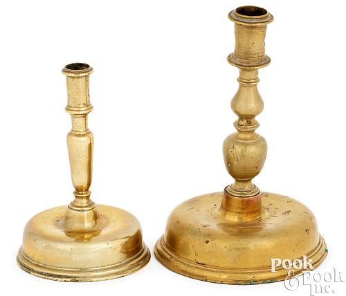 Two Continental brass candlesticks, late 17th c.
