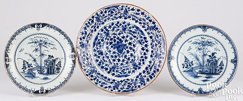 Delftware charger and two plates, 18th c.