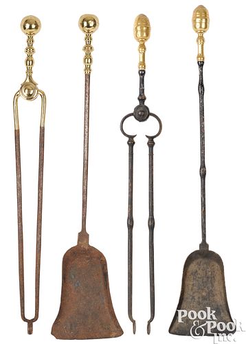 Two pair of wrought iron and brass fire tools
