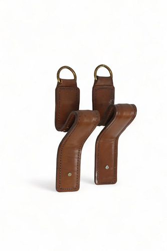 A pear of leader stitched coat hangers in the style of Jacques Adnet, Mid-20th Century