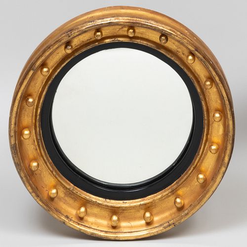 Regency Style Giltwood and Ebonized Convex Mirror
