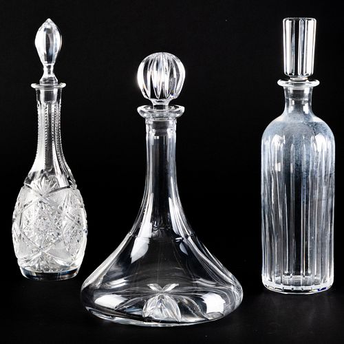 Group of Three Cut Glass Decanters and Stoppers
