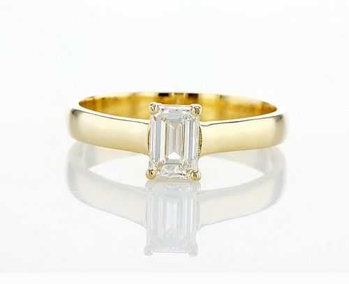 Smooth band and a single prominent 1.00CT emerald-cut clear diamond ring