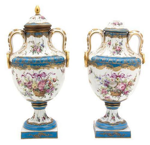 A Pair of French Sevres Gilt Bronze Mounted Lidded Urns Height 15 inches.