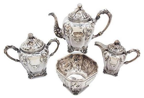 An American Coin Silver Tea Set, Wood & Hughes, New York, comprising a teapot, creamer, covered sugar, and waste bowl