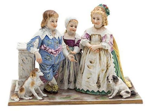 A German Porcelain Figural Group Height 5 1/2 x width 10 x depth 5 1/2 inches.