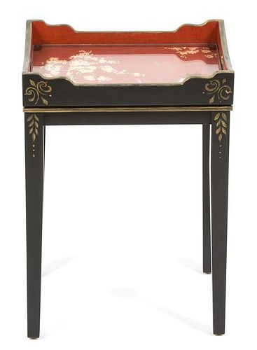A Regency Ebonized and Gilt Decorated Side Table Height 18 x width 13 x depth 9 1/2 inches.