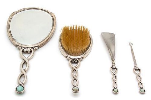 An Art Deco Silver Vanity Set, International Silver Co., New Jersey, 20th Century, with enamel and dolphin form mother-of-pea