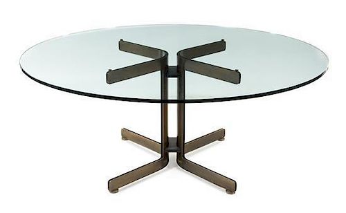 * A Modern Bronze and Glass Dining Table