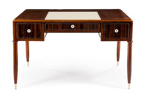 An Art Deco Ebene de Macassar Desk Height 31 x width 50 1/2 x depth 27 1/2 inches