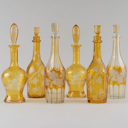Three Pairs of Amber Overlay Etched Glass Decanters and Stoppers