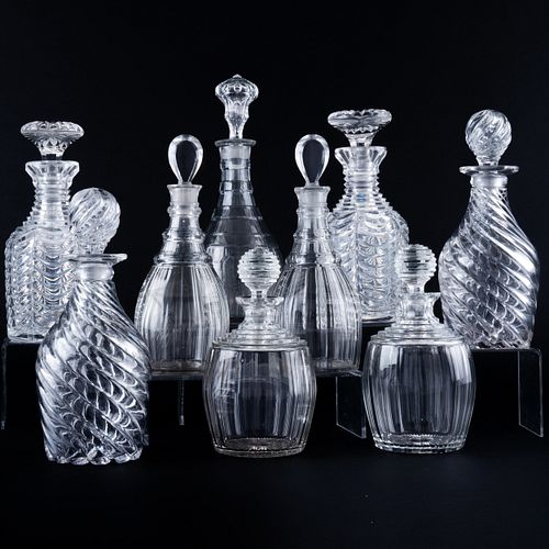 Group of Nine Cut Glass Decanters and Stoppers