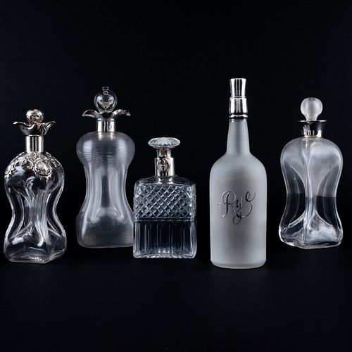 Group of Five Silver-Mounted Glass Decanters and Stoppers