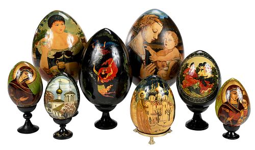 Eight Russian Hand Painted and Lacquered Eggs with Stands