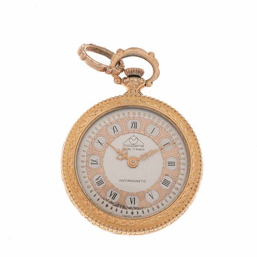 Reloj de bolsillo Modaine. Caja en acero dorado. Carátula en color gris con índices de números romanos.