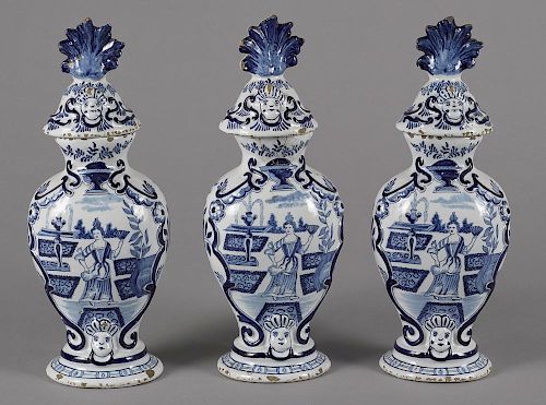 Three Delft garniture vases and covers, 18th/19th c., 13 1/2'' h. Provenance: Rentschler collection