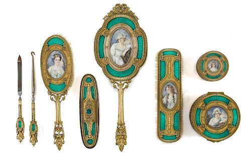 French brass and champlevé dresser set, early 20th c., with inset portraits, eight pieces.