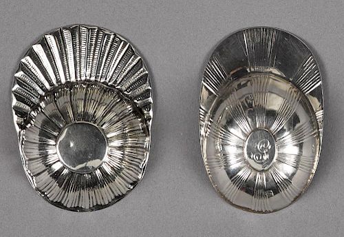 Two English silver jockey cap tea caddy spoons, one marked for Birmingham 1799, the second unmarke
