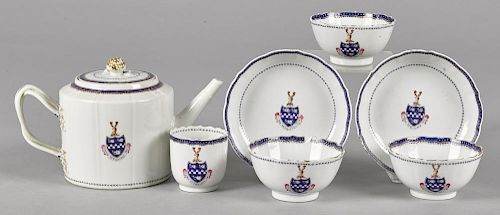 Chinese export porcelain teawares, early 19th c., to include a teapot, 5 3/4'' h., two saucers, and